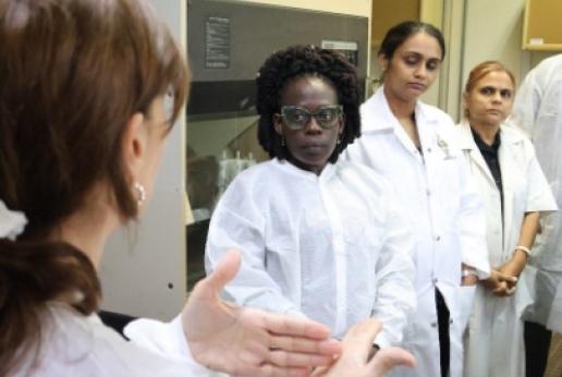  Pet Perry-Learmond, a lab assistant at the THA Animal Health Unit, listens to an FAO facilitator during training.