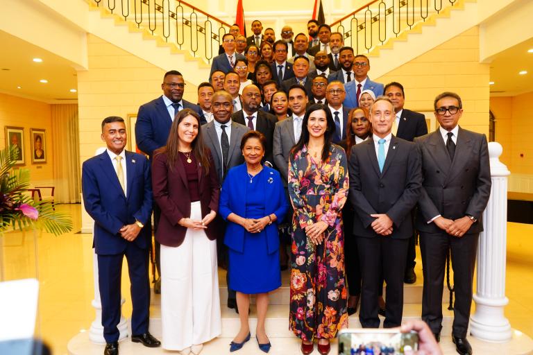 Prime Minister and members of her Cabinet stand with UNDP officials at the launch of the Human Development Report