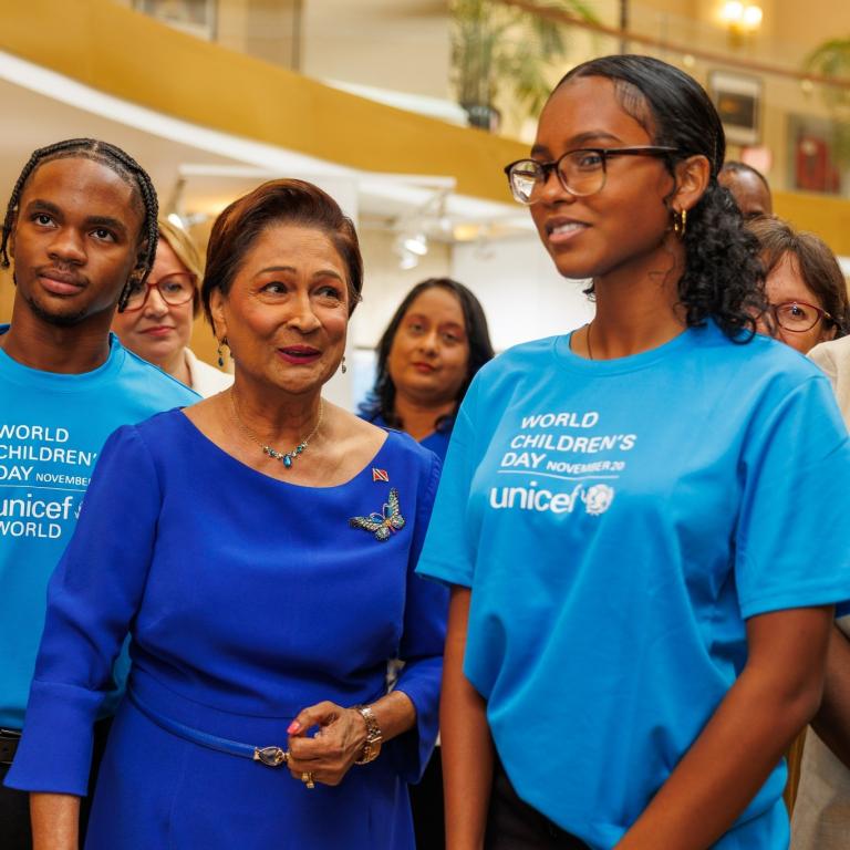 Prime Minister looks on at a young Child Friendly Cities participant